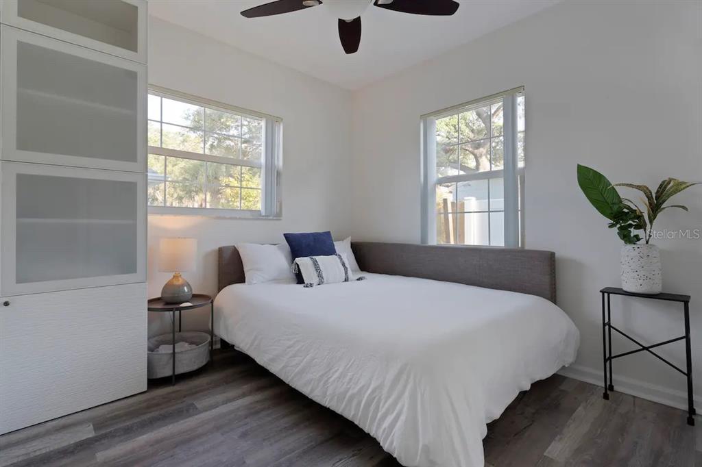 1411 Gray Street South Gulfport, FL 33707 - Photo 16 of 25 a bed sitting in a bedroom next to a window