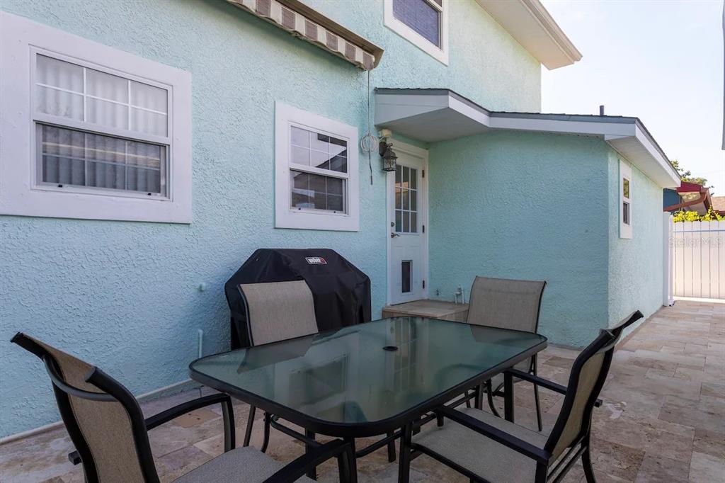 1411 Gray Street South Gulfport, FL 33707 - Photo 21 of 25 a backyard of a house with table and chairs