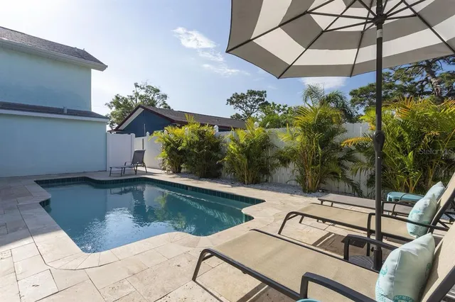 a view of a swimming pool with a patio