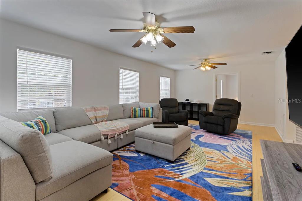 1411 Gray Street South Gulfport, FL 33707 - Photo 3 of 25 a living room with furniture and a chandelier