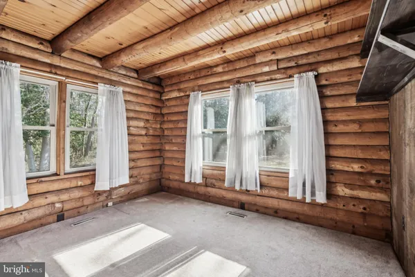 a view of a room with a large window