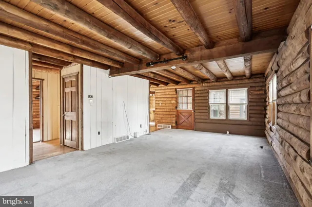 a view of an empty room with a window