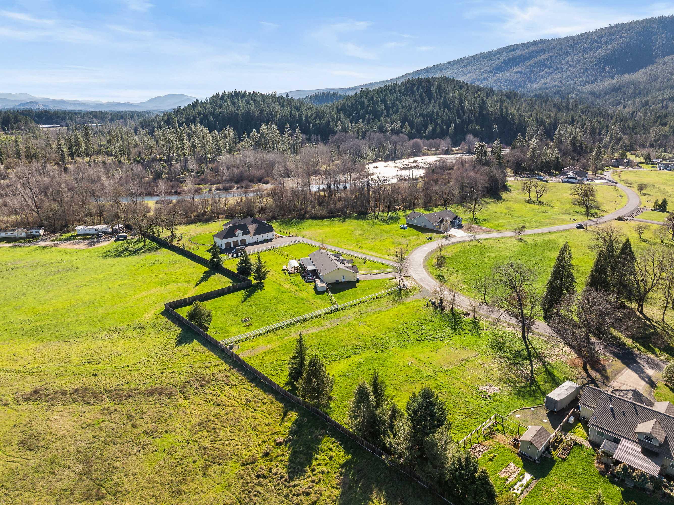 527 East Forks Circle Cave Junction, OR 97523 - Photo 4 of 12 a view of a swimming pool with a yard