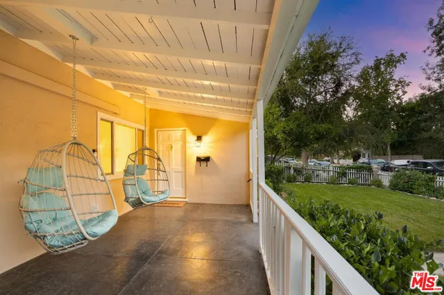 a view of a pathway both side of house