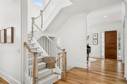 a view of a hardwood & staircase window