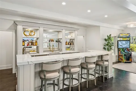 a kitchen with stainless steel appliances granite countertop a stove and a sink with cabinets