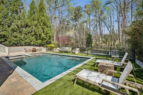 a view of backyard with a table and chairs
