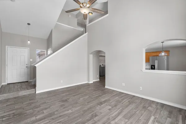 a view of an entryway with wooden floor