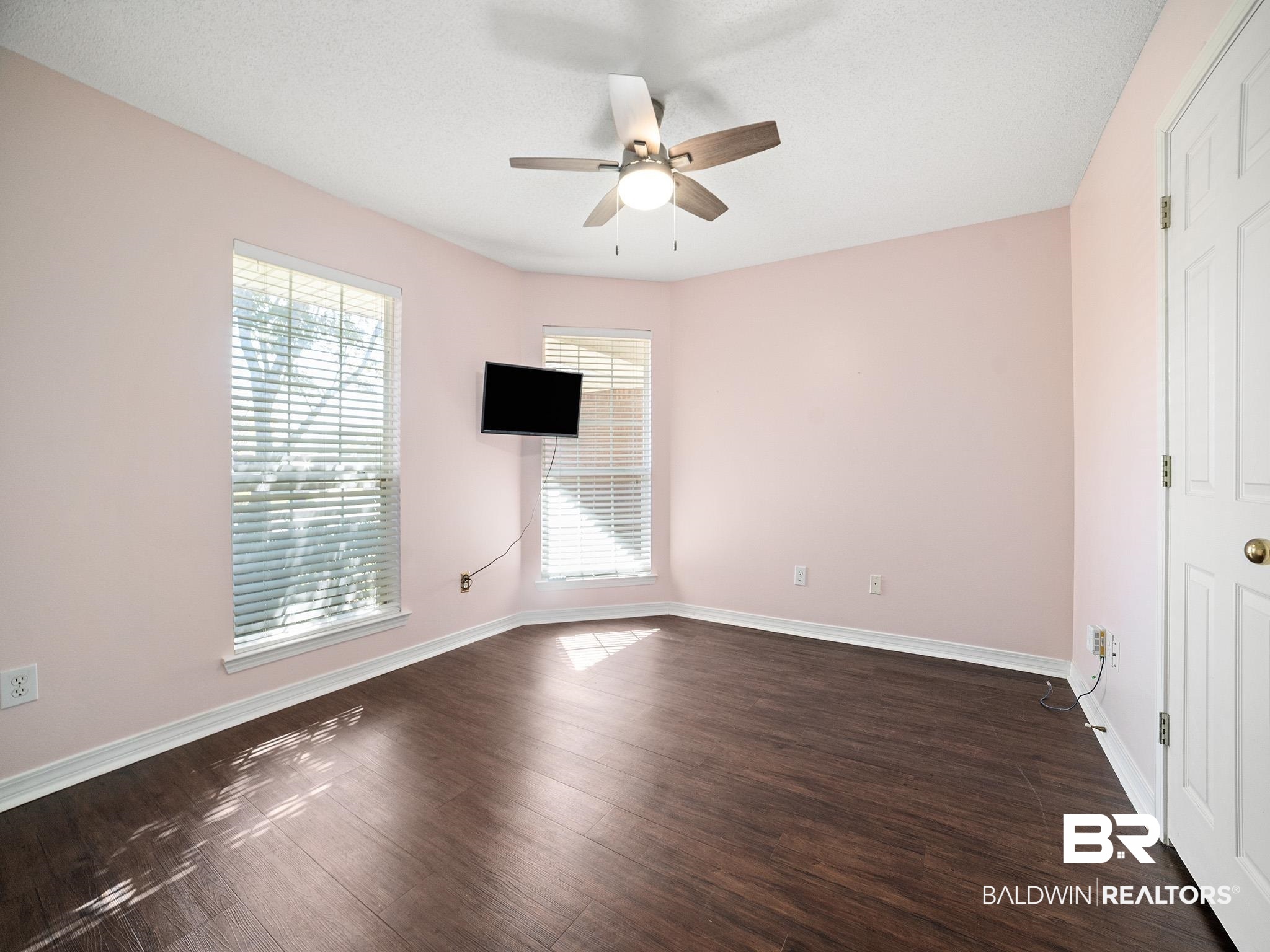 8320 Milton Road Mobile, AL 36695 - Photo 19 of 27 Empty room featuring dark hardwood / wood-style flooring, a textured ceiling, and ceiling fan