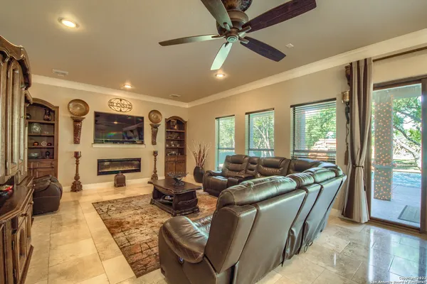 a kitchen with stainless steel appliances granite countertop a sink and a refrigerator