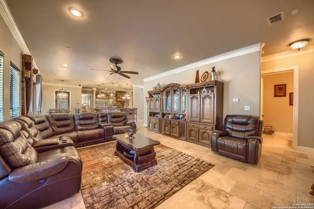 a kitchen with stainless steel appliances granite countertop a sink and a refrigerator