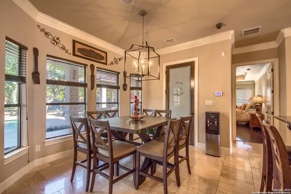 a kitchen with cabinets and wooden floor