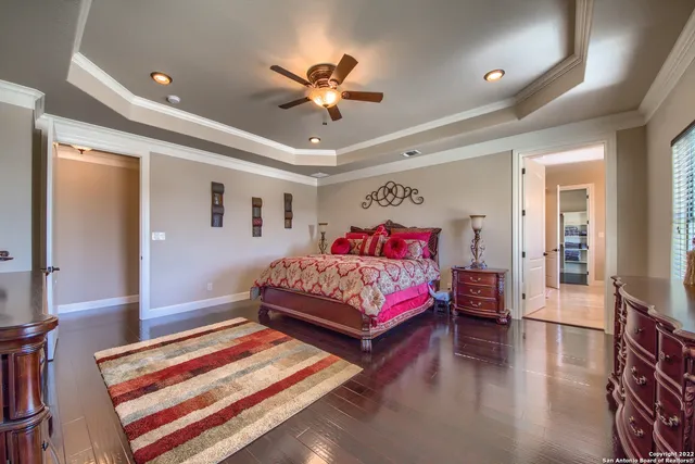 a bedroom with a large bed and a large window