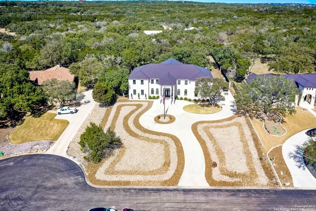 a view of a swimming pool with a yard