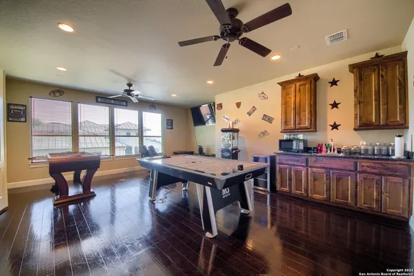 a view of a chairs and table in backyard