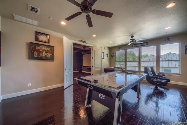 a view of a backyard with swimming pool