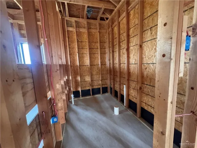 a view of an empty room with windows