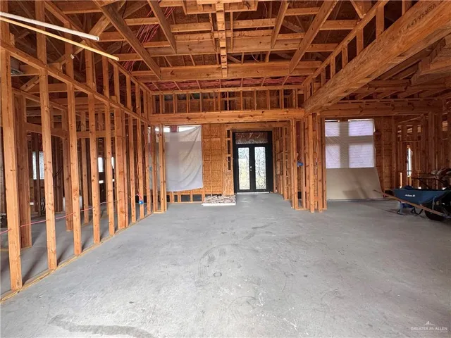 a view of an empty room with windows