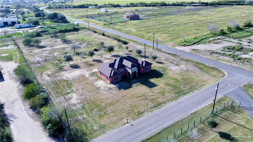 23611 Goldwing Way Edcouch, TX 78538 - Photo 26 of 26 a view of a lake with a yard and potted plants