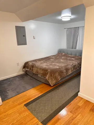 a bedroom with a bed and a floor