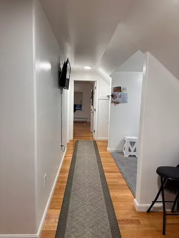 a view of a hallway with a couch