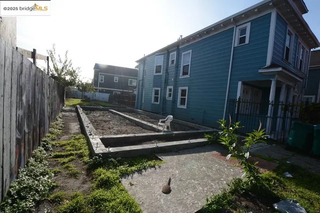 a view of a house with potted plants
