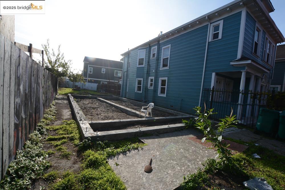 1633 8th Street Oakland, CA 94607 - Photo 25 of 56 a view of a house with a backyard