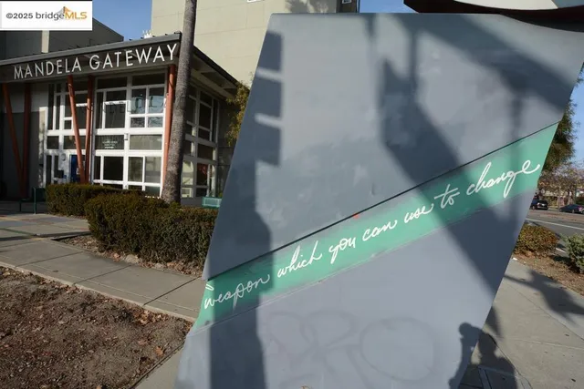 a view of a brick building with a bench in front of building