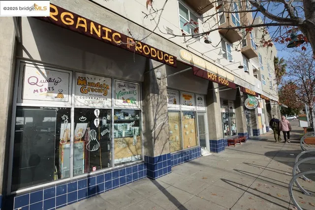 a table with wine bottles and potted plants on it