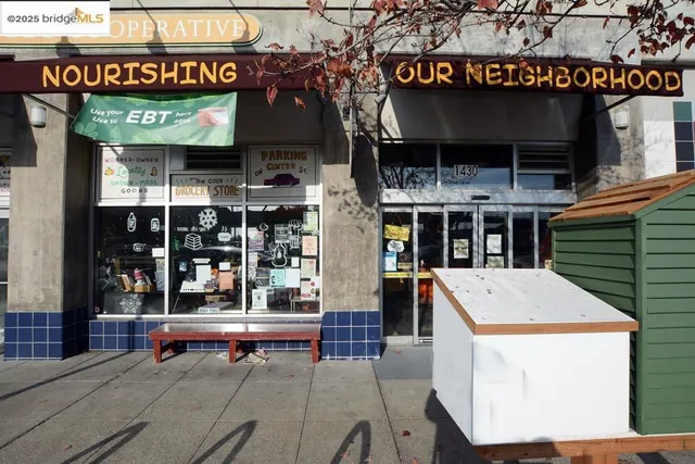 a view of a street with potted plants