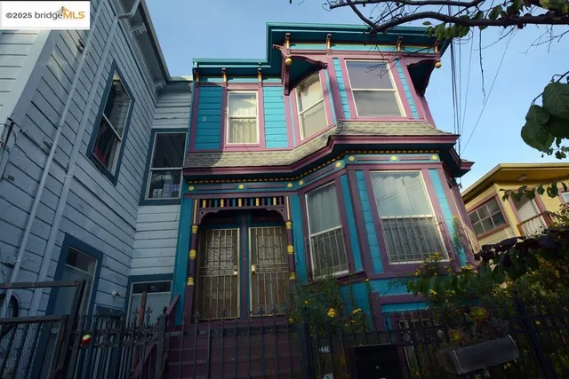 a view of a street with a garage