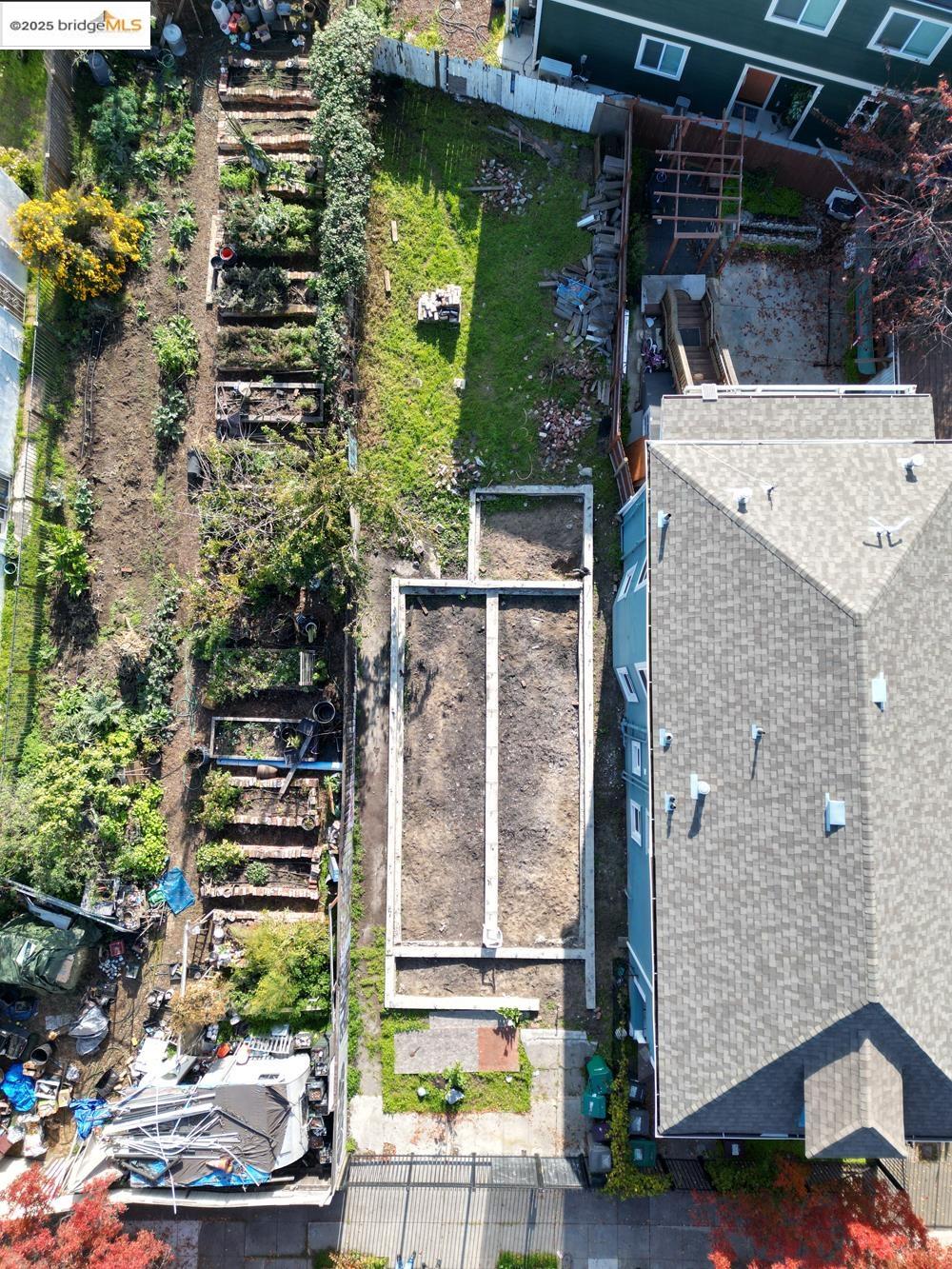1633 8th Street Oakland, CA 94607 - Photo 5 of 56 a view of a patio with table and chairs and potted plants