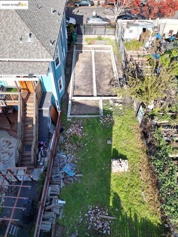 a view of a house with a swimming pool and a yard
