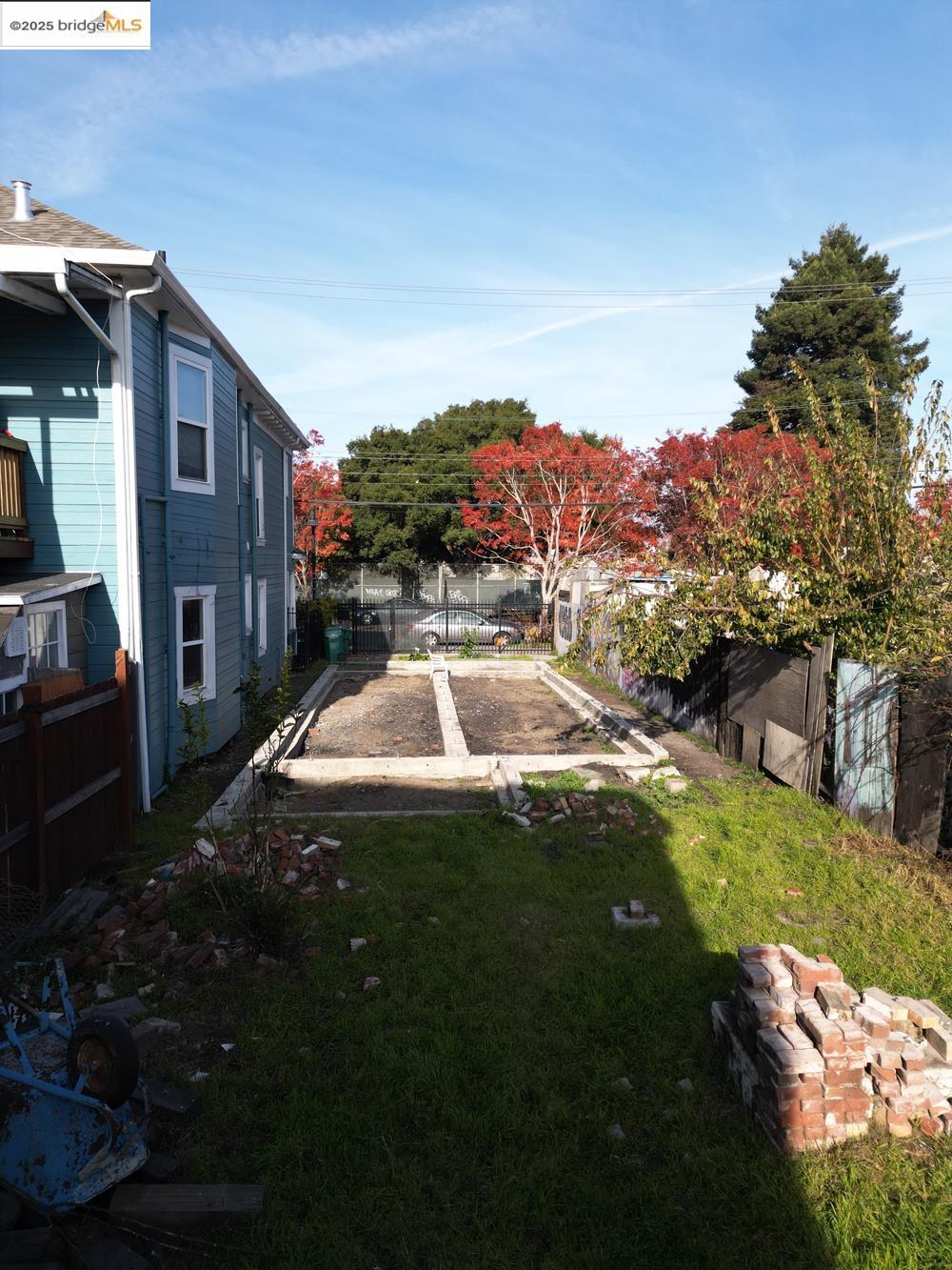 1633 8th Street Oakland, CA 94607 - Photo 9 of 56 a view of a house with a swimming pool and a yard