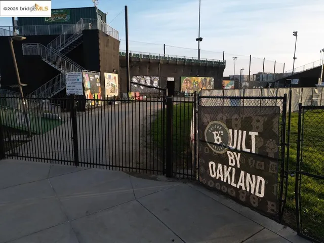 an aerial view of a residential houses with outdoor space