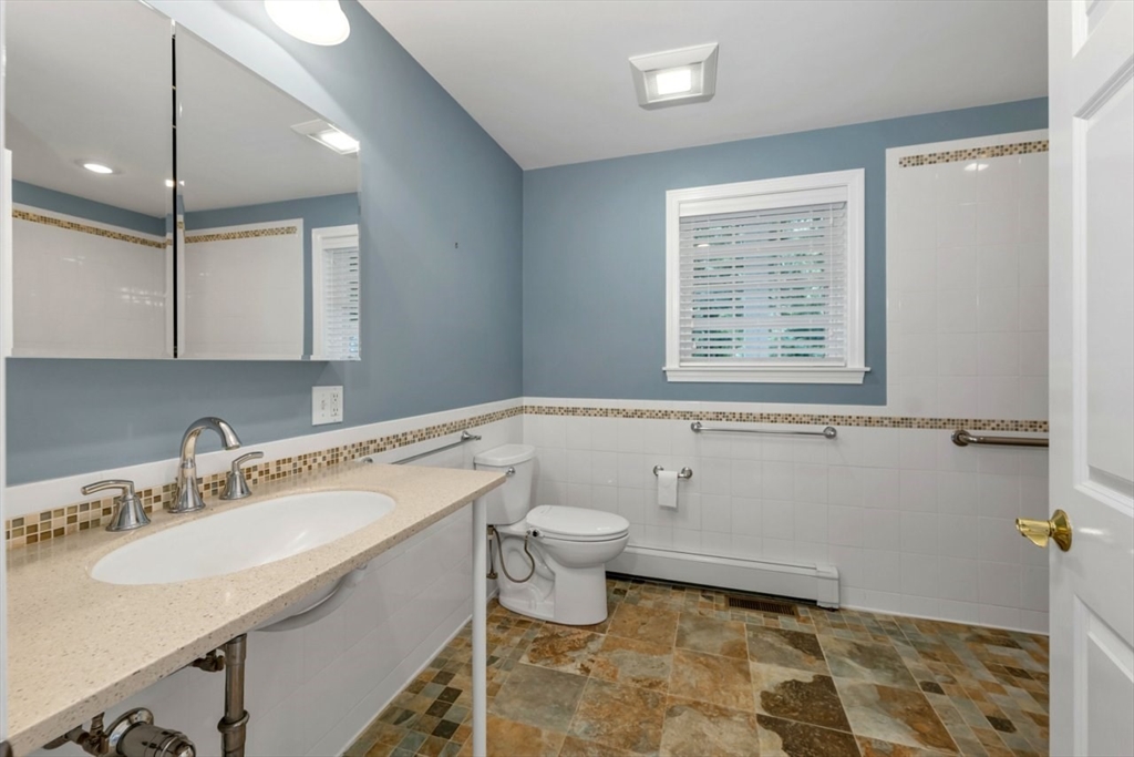 252 Littlefield Road Boxborough, MA 01719 - Photo 17 of 40 a bathroom with a sink toilet and shower