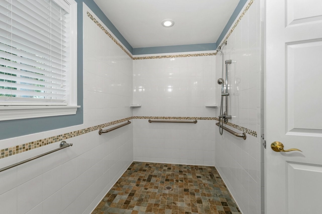 252 Littlefield Road Boxborough, MA 01719 - Photo 18 of 40 a bathroom with a window and a shower