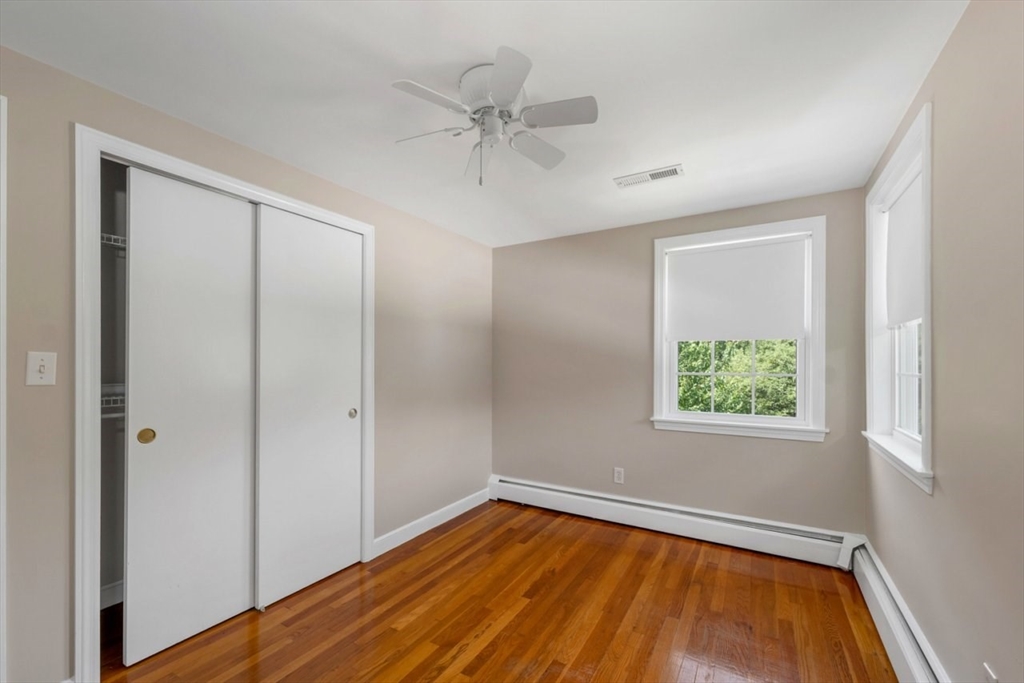 252 Littlefield Road Boxborough, MA 01719 - Photo 20 of 40 wooden floor in an empty room with a window