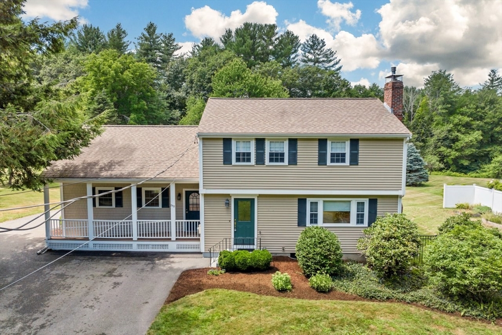 252 Littlefield Road Boxborough, MA 01719 - Photo 2 of 40 a front view of a house with a yard