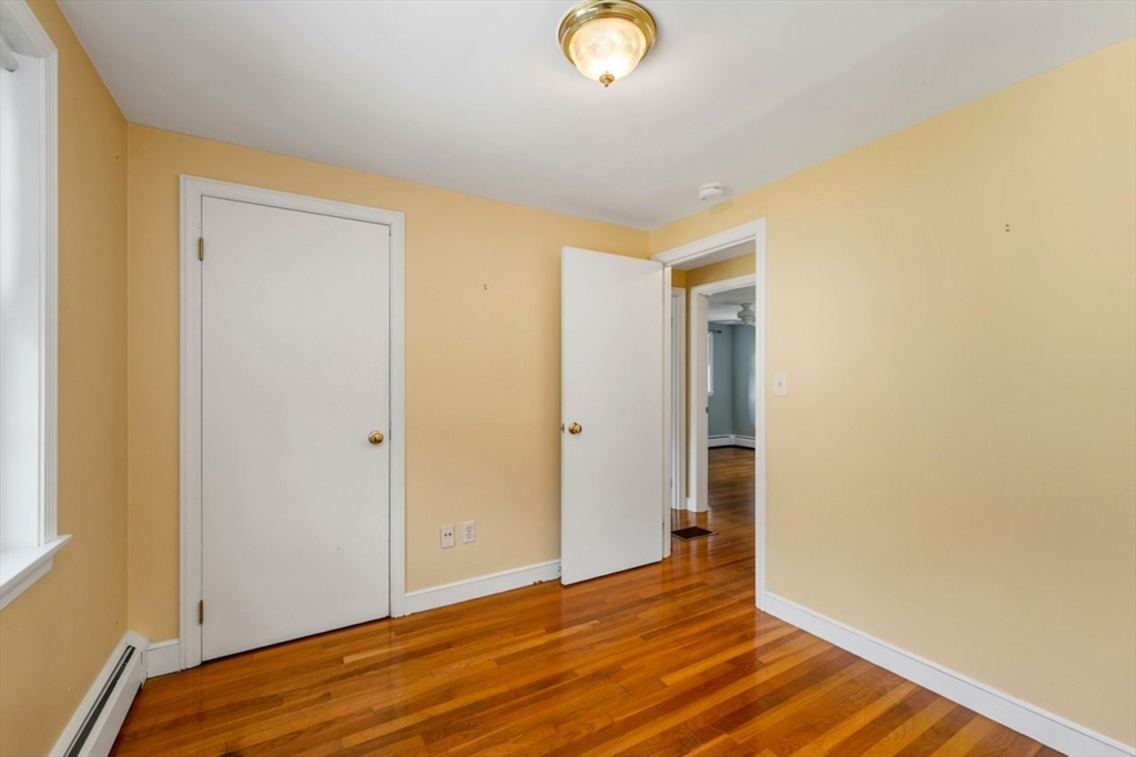252 Littlefield Road Boxborough, MA 01719 - Photo 25 of 40 a view of empty room with wooden floor