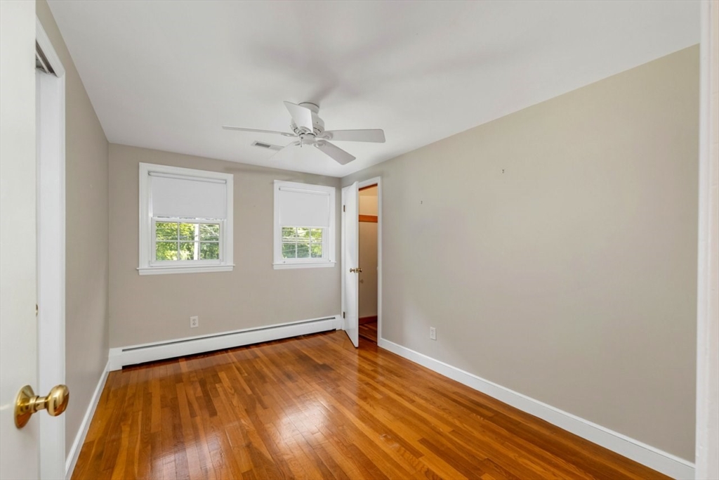 252 Littlefield Road Boxborough, MA 01719 - Photo 26 of 40 wooden floor in an empty room with a window