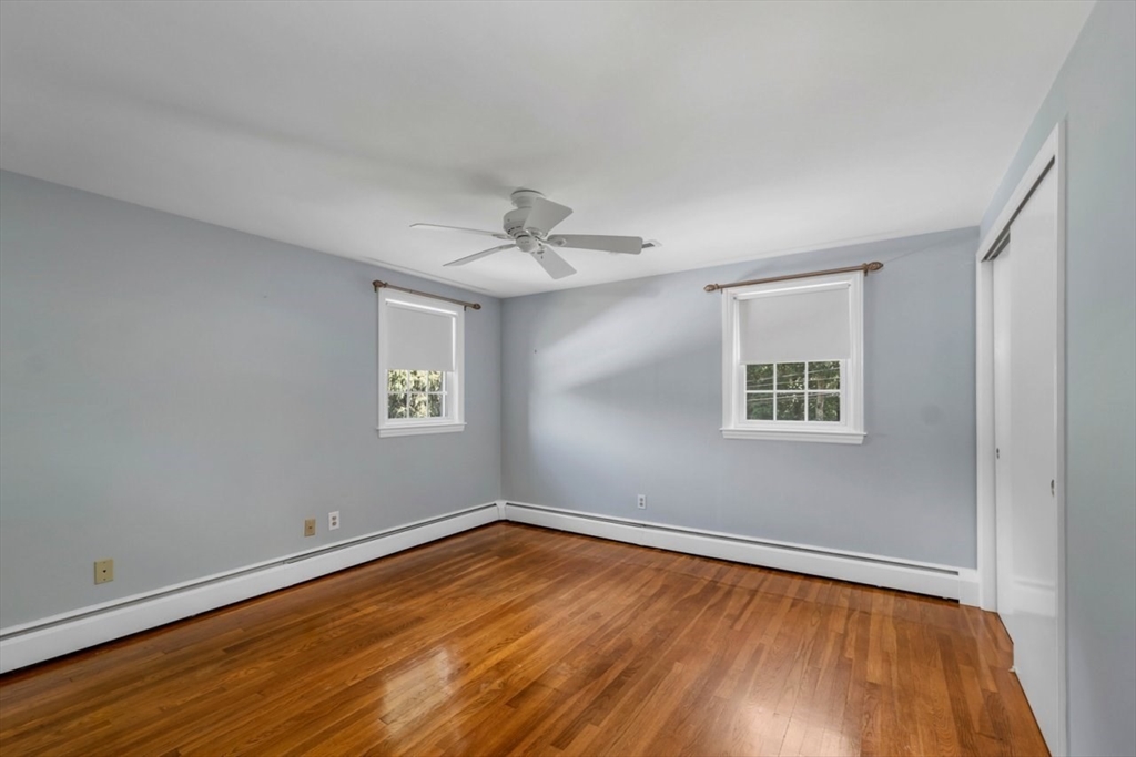 252 Littlefield Road Boxborough, MA 01719 - Photo 27 of 40 wooden floor in an empty room with a window