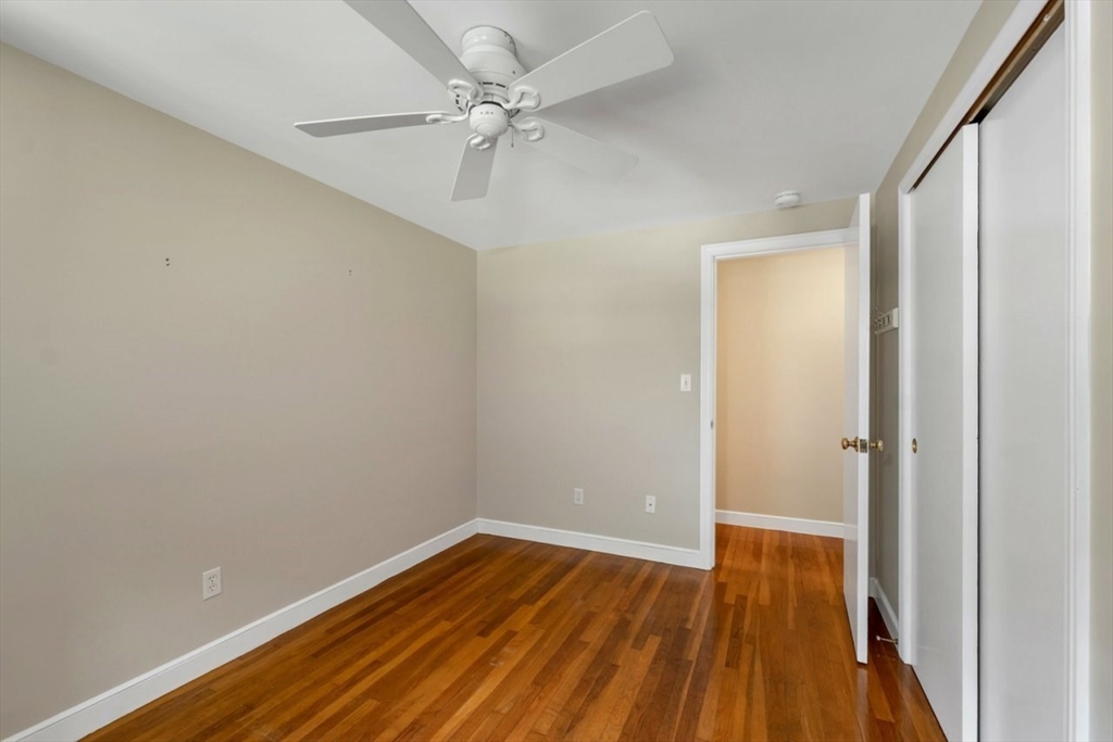 252 Littlefield Road Boxborough, MA 01719 - Photo 32 of 40 wooden floor in an empty room with a window