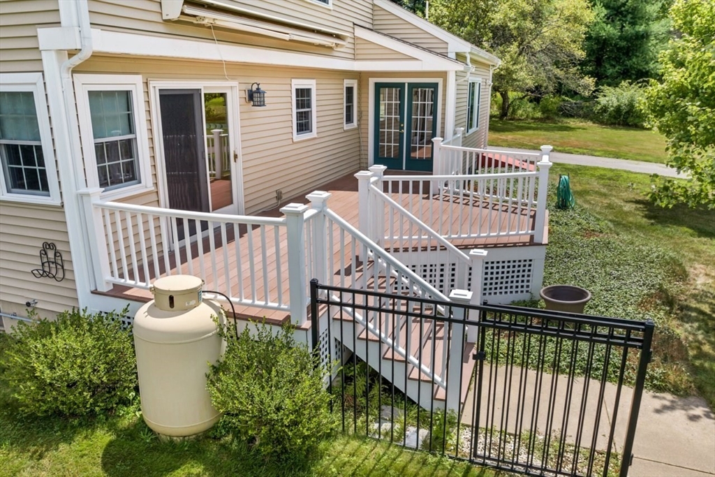 252 Littlefield Road Boxborough, MA 01719 - Photo 35 of 40 a view of a chair and table in the patio