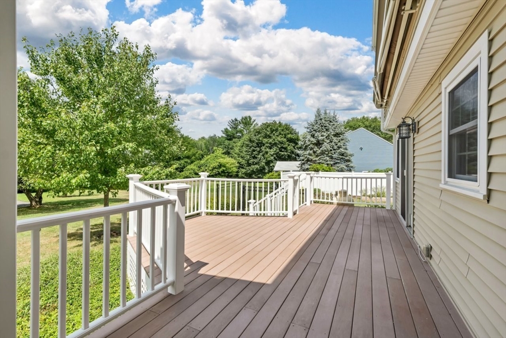 252 Littlefield Road Boxborough, MA 01719 - Photo 36 of 40 a balcony with wooden floor and fence