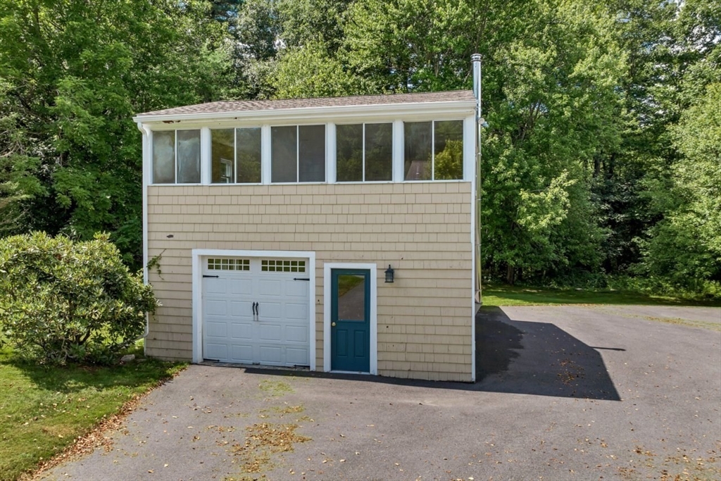 252 Littlefield Road Boxborough, MA 01719 - Photo 37 of 40 a view of a house with a yard