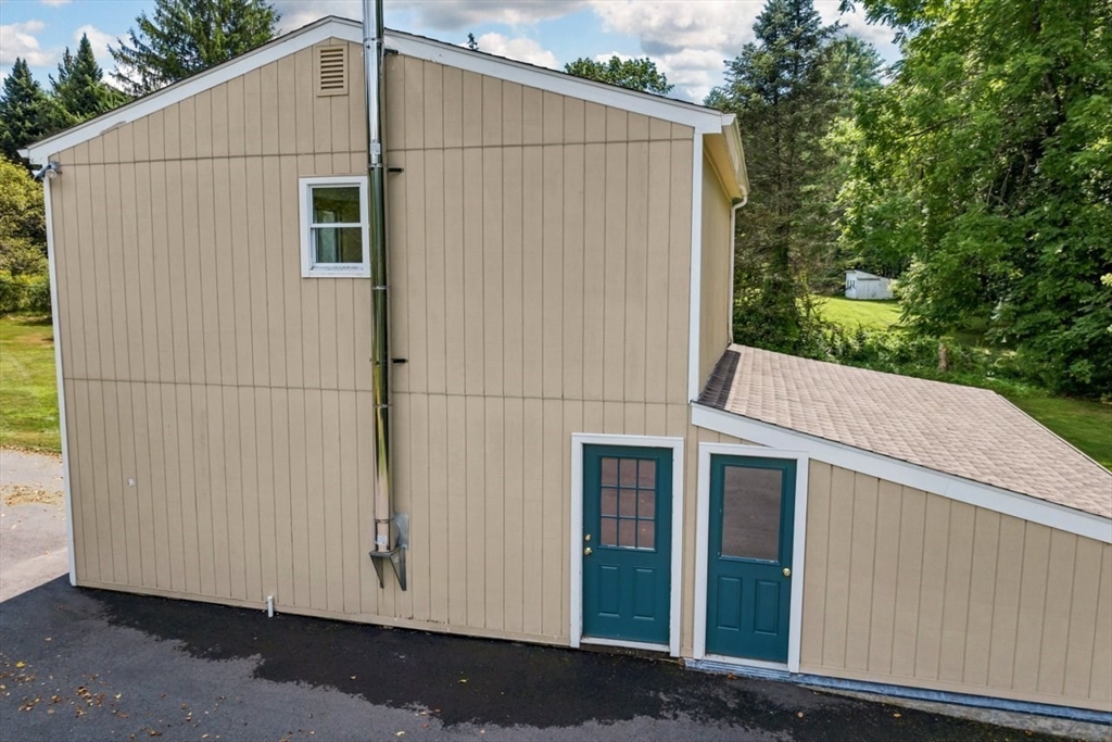 252 Littlefield Road Boxborough, MA 01719 - Photo 38 of 40 a house view with a backyard