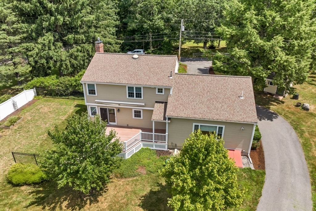 252 Littlefield Road Boxborough, MA 01719 - Photo 39 of 40 aerial view of a house with a yard and potted plants