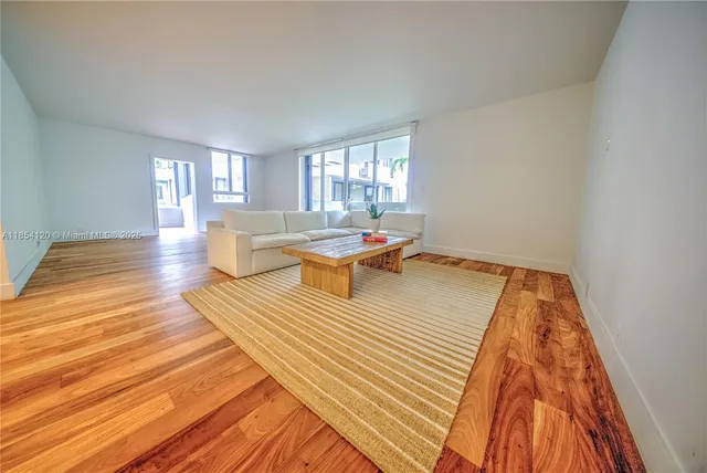 a living room with a couch and window