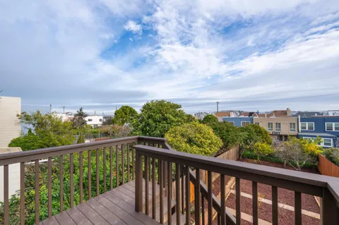 a view of a city skyline from a balcony
